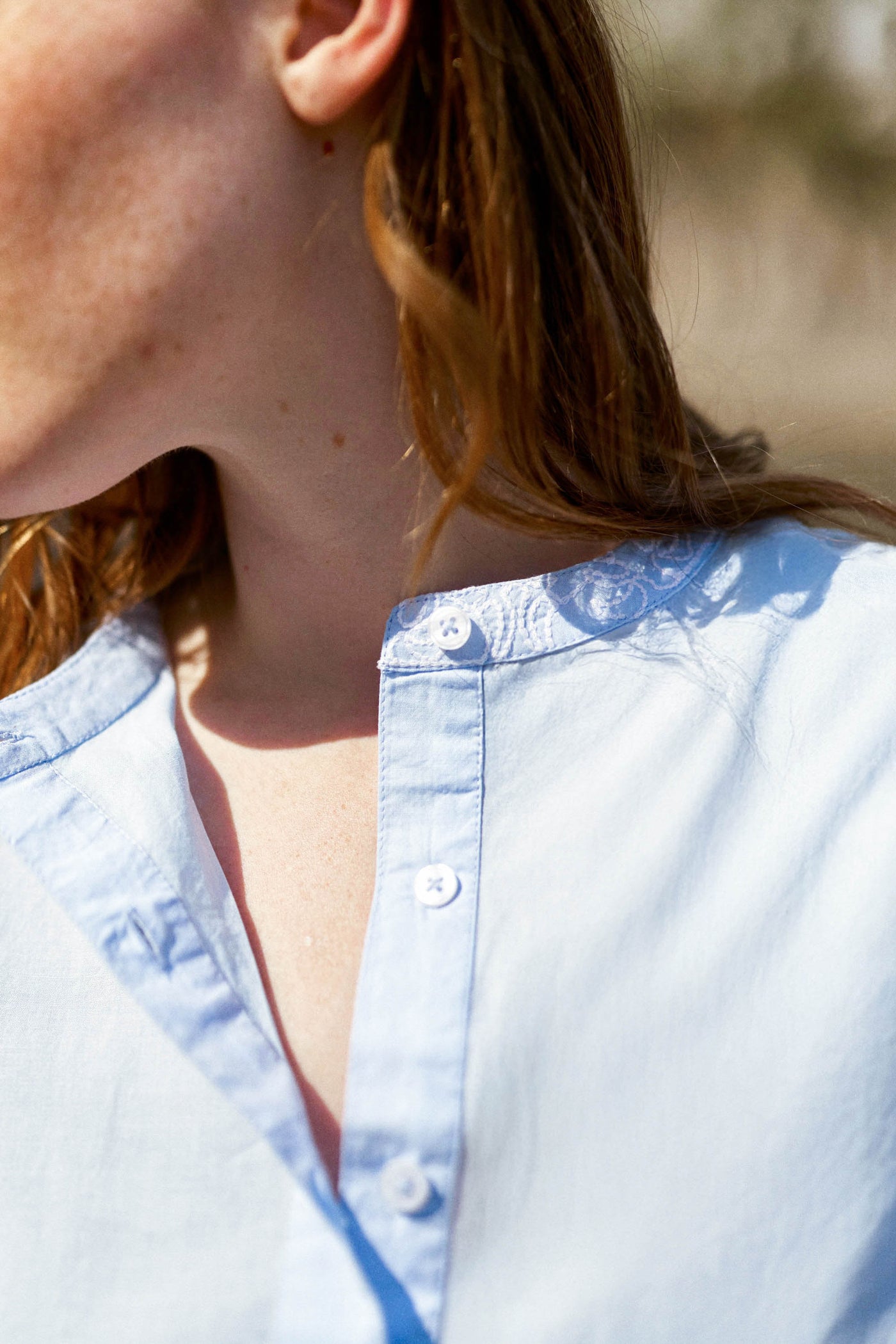 Straight blouse with sky blue embroidered details - Bloy
