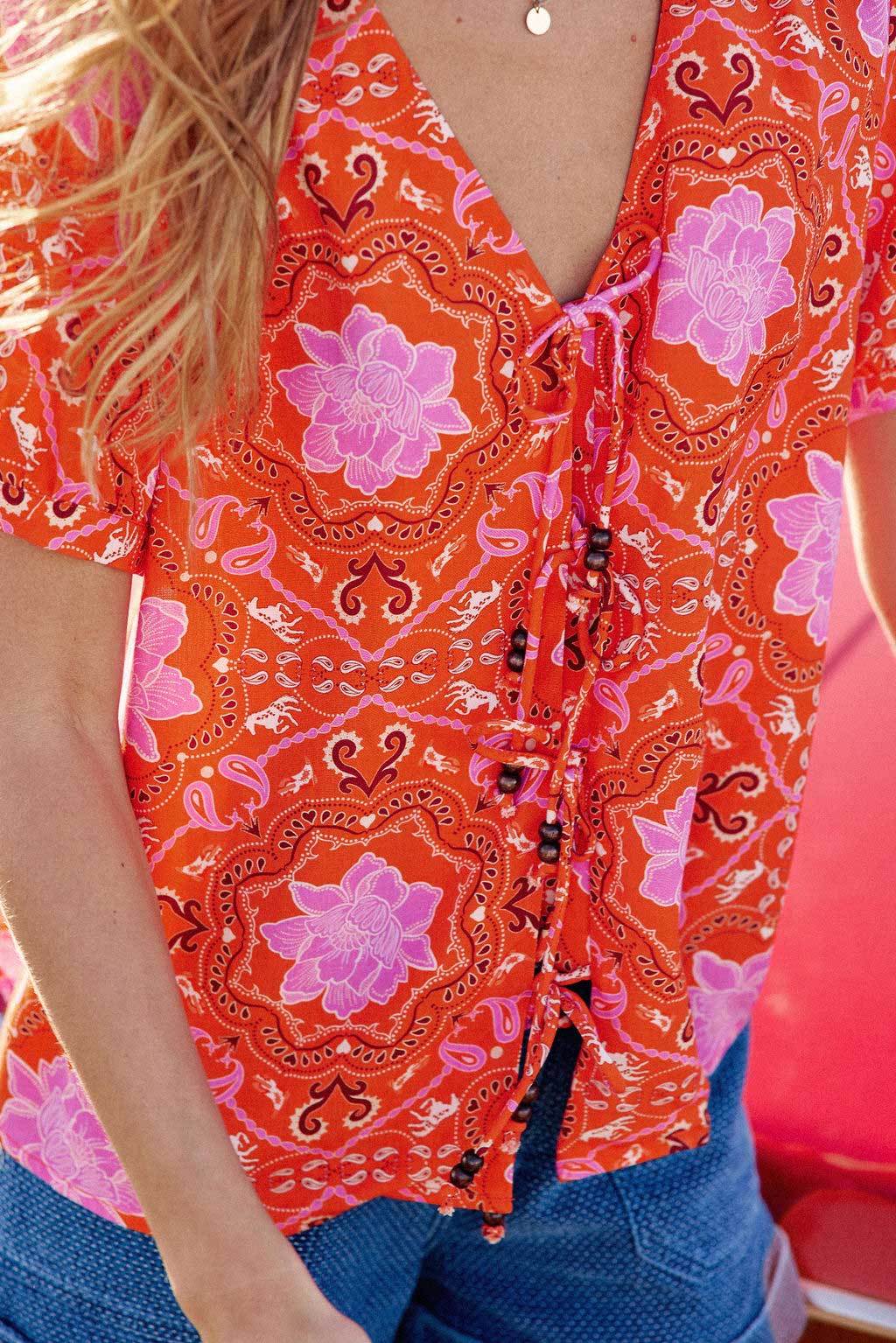 Orange V-neck top - Thuy