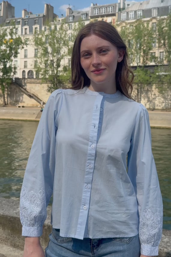 Straight blouse with sky blue embroidered details - Bloy